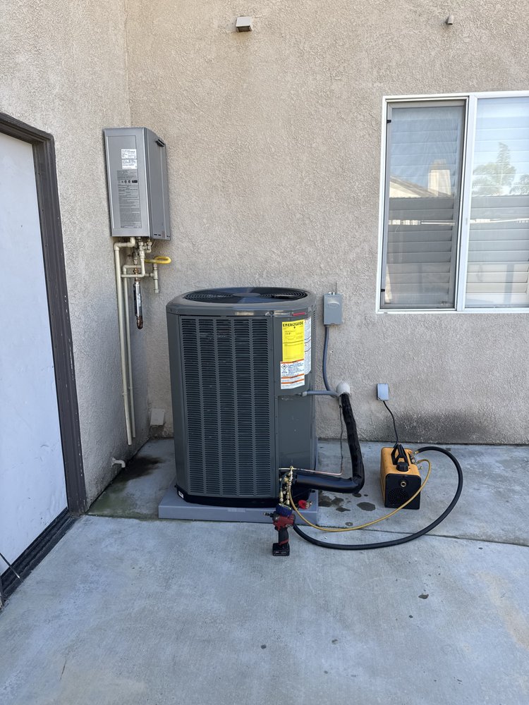 New AC condenser installation with tankless water heater